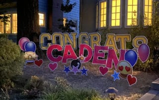 Congratulations yard-card display for a Portland-area graduate