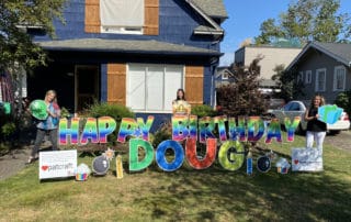 A colorful lawn card featuring happy birthday greeting and fun decor in Sellwood