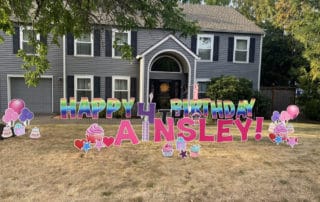 Big house in NW Portland with Happy Birthday spelled out in huge letters