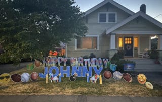 Colorful Happy Birthday lawn greeting at a home in SE Portland